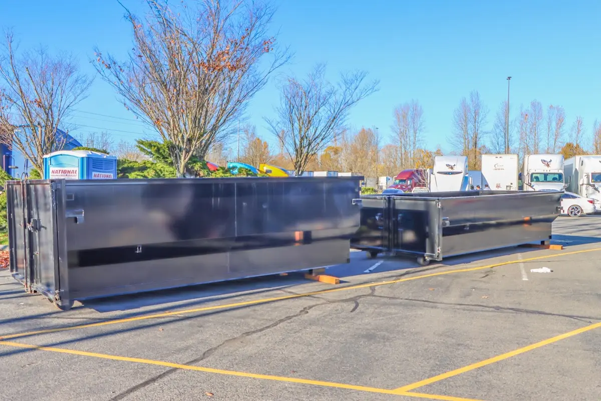 Professional dumpster rental service with roll-off container on residential driveway in Lake Murray of Richland